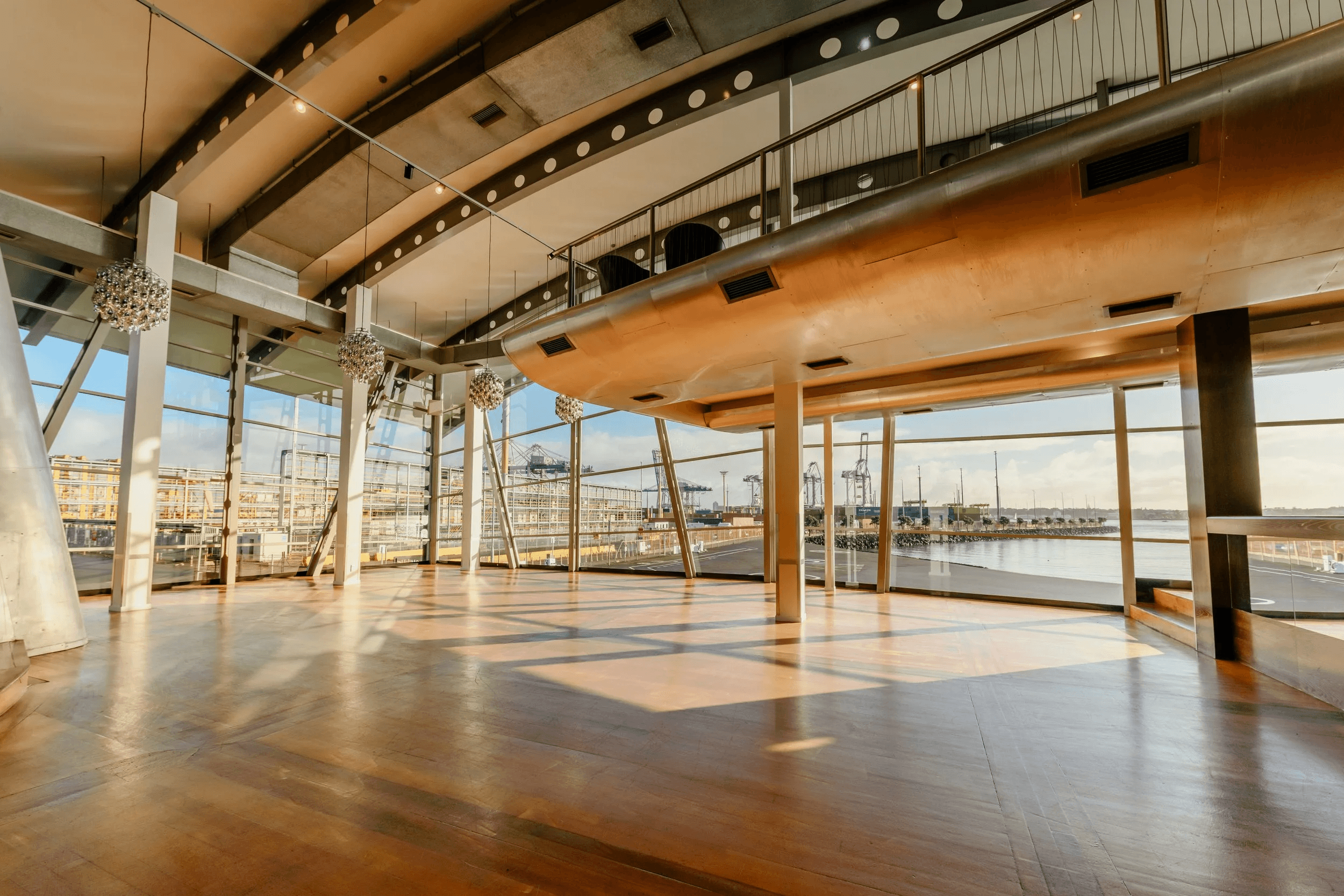 The waterfront venue — panoramic glass views over the Hauraki Gulf